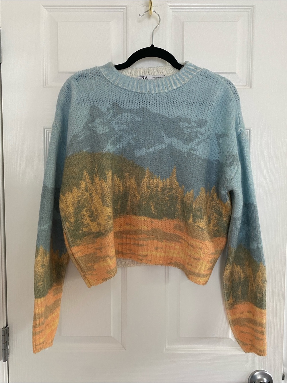 Zara Sky Blue Scenic Crewneck Sweater with Golden & Orange Landscape